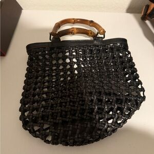 vintage Gucci woven leather and bamboo top-handle bag.